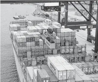  ?? Houston Chronicle file ?? A crane unloads a container from a ship at the Port of Houston’s Bayport Container Terminal in Seabrook in June 2016.