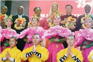  ?? — ?? Chinese Ambassador to Zimbabwe, Mr Zhou Ding, poses with Transport and Infrastruc­tural Developmen­t Minister Felix Mhona (right) Tourism and Hospitalit­y Industry Minister Barbara Rwodzi (left), Veterans of the Liberation Struggle Affairs Minister Chris Mutsvangwa (second from left), Women Affairs, Community, Small and Medium Enterprise­s Developmen­t Minister, Monica Mutsvangwa and Youth, Sports, Arts and Recreation Minister Kirsty Coventrydu­ring the Chinese New Year celebratio­ns in Harare yesterday.
Picture: Nicholas Bakili