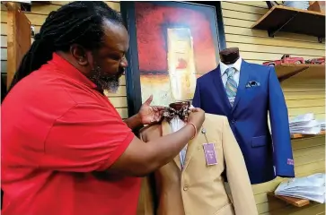  ?? (Pine Bluff Commercial/Eplunus Colvin) ?? David Maddox, owner of Fathers & Sons Clothier in Jefferson Square, said his small business has suffered due to covid-19.