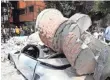  ?? ALFREDO ESTRELLA, AFP/GETTY IMAGES ?? A car was crushed by debris from a damaged building after a quake rattled Mexico City.