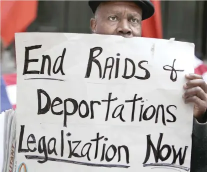  ?? AP FILES ?? A protester at an immigratio­n rally in May in Chicago.