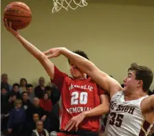  ?? CHRIS CHRISTO / HERALD STAFF ?? MAKE HIM EARN IT: Catholic Memorial's Eoin Gormley gets fouled by BC High's Ozzy Trapilo while going up for a shot during the Eagles 56-50 victory.