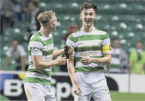  ??  ?? 0 Captain for the night Kieran Tierney, right, celebrates with Calvin Miller following the 5-0 win that sealed Celtic’s place in the last eight.