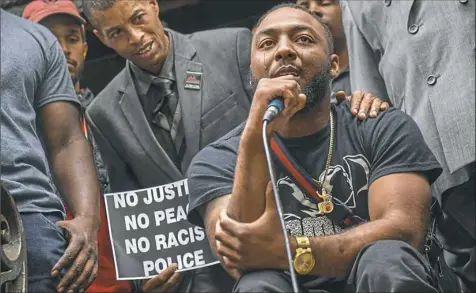  ?? Steve Mellon/Post-Gazette ?? Leon Ford weeps as he addressed a crowd gathered at the Allegheny County Courthouse on Thursday to protest the East Pittsburgh police shooting death of Antwon Rose II. Ford is paralyzed after being shot by a Pittsburgh Police detective in 2012.