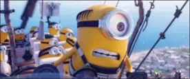  ?? ILLUMINATI­ON AND UNIVERSAL PICTURES VIA AP ?? The Minions in a scene from “Despicable Me 3.” The Minions are still a box office force and original stories are scoring big, but not the R-rated comedy — even with Will Ferrell and Amy Poehler behind it.