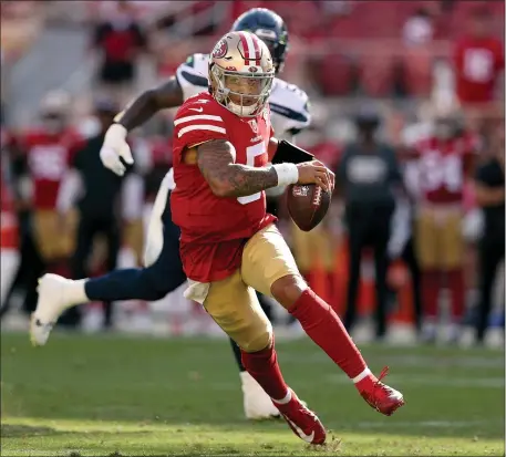  ?? EZRA SHAW — GETTY IMAGES ?? Trey Lance of the San Francisco 49 ers runs the ball during the fourth quarter against the Seattle Seahawks at Levi’s Stadium on Sunday, Oct. 3, 2021 in Santa Clara, California.