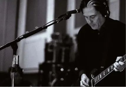  ??  ?? Troy Van Leeuwen tracking parts for
Villains in the studio