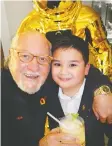  ??  ?? Greeting Matteo Escoto, 9, at an Omega reception, George Frankel said his family-owned Bridges restaurant will get a $15M reno.