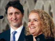  ?? CP PHOTO FRED CHARTRAND ?? Prime Minister Justin Trudeau looks on as former astronaut, and Governor General designate, Julie Payette, talks to reporters Thursday on Parliament Hill.