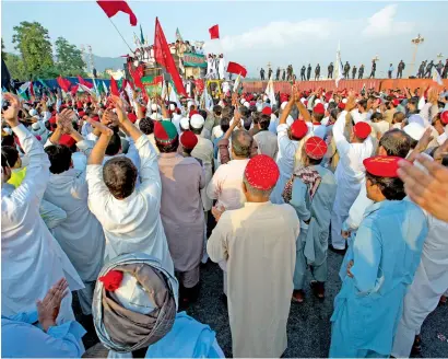  ?? AP ?? Protesters and lawmakers from the tribal areas raise slogans against the government during the rally near parliament in Islamabad. —