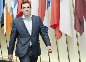 ?? JOHN THYS/AFP/GETTY IMAGES ?? Greek Prime Minister Alexis Tsipras has so far refused to surrender to the EU, the European Central Bank and the Internatio­nal Monetary Fund on any of their main bailout conditions.