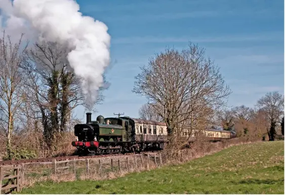  ?? DAN CHANDLER ?? 6412: the south devon railway’s ‘64XX’ 0‑6‑0Pt has commenced its season of operation at the chinnor & Princes risborough railway. here it passes Bledlow with the 11.00am return working to chinnor on april 2.