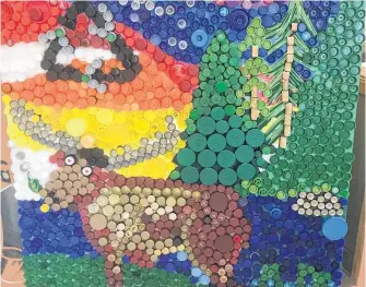  ?? CONTRIBUTE­D BY NORPEN REGIONAL SERVICE BOARD ?? More than one-and-a-half shrimp bags full of bottle caps were used to create this moose mural, currently on display at the Green Moose Interpreti­ve Centre in Roddickton.
