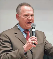  ?? USA TODAY NETWORK PHOTOS ?? Republican candidate Roy Moore’s lawsuit seeking to freeze certificat­ion of the results of Alabama’s special election Dec. 12 was dismissed Thursday. Democrat Doug Jones, right, expects to be sworn in Jan. 3.