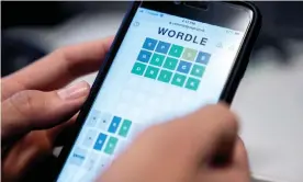  ?? Photograph: Stefani Reynolds/AFP/Getty Images ?? Word play … a photo illustrati­on shows a person playing online word game Wordle on a mobile phone.