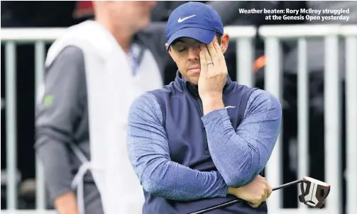  ??  ?? Weather beaten: Rory McIlroy struggleda­t the Genesis Open yesterday