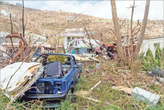  ?? the British Ministry of Defence via AP ?? Cars have been turned to wrecks by Hurricane Irma on the British Virgin Islands. The wild isolation that made St. Barts, St. Martin, Anguilla and the Virgin Islands vacation paradises has turned them into cutoff, chaotic nightmares in the wake of Hurricane Irma, which left dozens of people dead, mostly in the Leeward Islands.