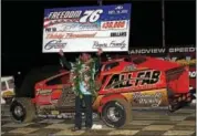  ?? RICK KEPNER — DIGITAL FIRST MEDIA ?? Jeff Strunk celebrates in victory lane after winning the Freedom 76 at Grandview Speedway on Saturday night.