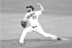  ??  ?? Clayton Kershaw #22 of the Los Angeles Dodgers pitches during the third inning against the Houston Astros in game one of the 2017 World Series at Dodger Stadium on October 24, 2017 in Los Angeles, California. - AFP photo