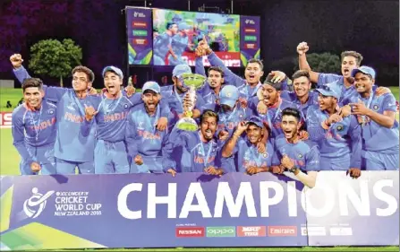  ??  ?? The Indian team celebrates their victory over Australia after the final at Bay Oval in Mount Maunganui on Saturday.