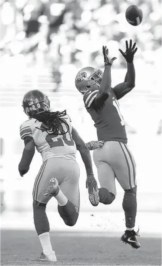  ?? MARCIO JOSE SANCHEZ/AP ?? San Francisco 49ers wide receiver Marquise Goodwin, right, catches a touchdown pass in front of New York Giants cornerback Janoris Jenkins during the first half of their game in Santa Clara, California, on Nov. 12, 2017.