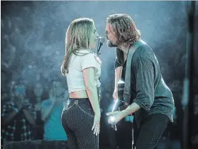  ?? CLAY ENOS
THE ASSOCIATED PRESS ?? Lady Gaga, left, and Bradley Cooper in a scene from “A Star is Born.”