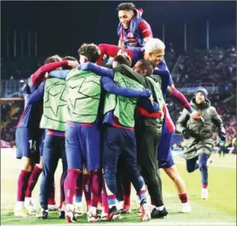  ?? ?? Barcelona players celebratin­g after their 3-1 defeat of Napoli last night to reach the quarter finals of the UEFA Champions League