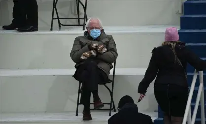  ?? Photograph: Brendan Smialowski/AFP/Getty Images ?? Former presidenti­al candidate Senator Bernie Sanders with his internet-famous mittens.