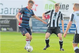  ?? Picture: Kath Flannery. ?? Ross County’s Joel MacBeath, left, in action against Fraserburg­h, has joined Montrose on loan.