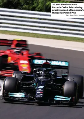  ?? Lars Baron/Getty Images ?? Lewis Hamilton leads Ferrari’s Carlos Sainz during practice ahead of tomorrow’s Hungarian Grand Prix
