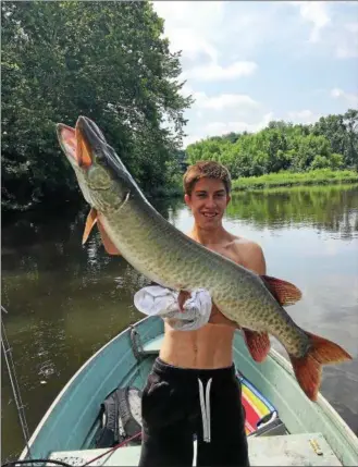  ?? SUBMITTED PHOTO ?? Kevin Rodenbaugh shows off the 45-inch muskie he caught on the Schuylkill River. The photo, which was posted on the Schuylkill River Greenways’ Facebook page, has gone viral.