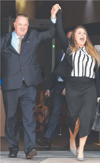  ?? Picture: DAVE HUNT/AAP ?? Former Queensland Police officer Rick Flori and social justice advocate Renee Eaves celebrate as they leave Southport Magistrate­s Court yesterday.