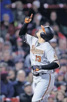  ?? [CHARLES KRUPA/THE ASSOCIATED PRESS] ?? Baltimore’s Manny Machado points upward as he scores on his solo home run off Boston starting pitcher Rick Porcello during the sixth inning Monday at Fenway Park in Boston. BLUE JAYS 7, YANKEES 1: BREWERS 7, CARDINALS 5, 10 INNINGS: