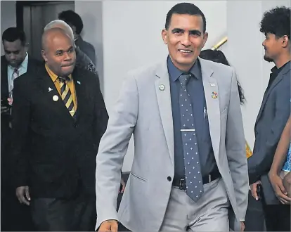  ?? Picture: ELIKI NUKUTABU ?? Opposition member Hem Chand leads Taito Rokomatu at Parliament on Wednesday.