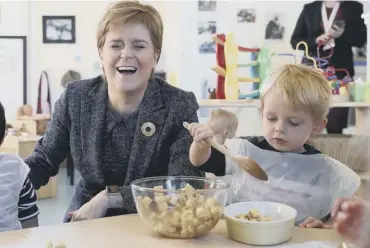  ??  ?? 0 Nicola Sturgeon pays a visit to Sauchie Nursery School in Alloa yesterday