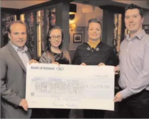  ??  ?? John Duggan and Rachel McCoy from the Martello present the cheque for ¤1,407 to Serena Kilkenny and Conor O'Leary of Bray Cancer Support.