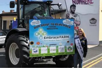  ??  ?? Emma Birchall, Queen of the Land 2017 at St Conleth’s Park, Newbridge with the Embrace FARM Drive to Remember tractor which Kildare Macra Club hosted on Thursday.