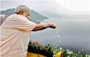  ?? — PTI ?? PM Narendra Modi offers prayers to the Narmada River during the inaugurati­on of the Sardar Sarovar Dam at Kevadiya in Narmada district on Sunday.
