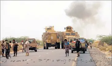  ?? Najeeb al Mahboobi EPA/Shuttersto­ck ?? YEMENI forces backed by the Saudi-led coalition take position in the offensive on the port of Hudaydah.