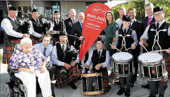  ??  ?? At the announceme­nt in Arklow that Virgin Media now has more than 900,000 premises using its ultrafast fibre broadband network. Picture are Arklow Pipe Band members, Virgin Media CEO Tony Hanway, Minister Denis Naughten, Retail Excellence deputy CEO...