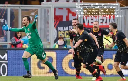  ??  ?? Benevento goalkeeper Alberto Brignoli, left, celebrates after scoring the equalizer at the end of the Italian Serie A soccer match between Benevento and AC Milan