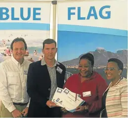  ??  ?? PROUD ACHIEVEMEN­T: At the presentati­on of Blue Flags awarded to Ndlambe earlier this month were, from left, Wildlife and Environmen­t Society of South Africa (Wessa) CEO Dr Tommy Burger, Ndlambe deputy-director: community protection services’s Fanie...