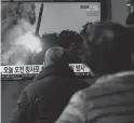  ?? AHN YOUNG-JOON/AP ?? People watch a news program showing a file image of North Korea’s rocket launch, at the Seoul Railway Station in Seoul, South Korea, Sunday. North Korea has conducted 10 weapon launches this year.