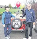  ??  ?? Vintage wheels: Blainroe’s 2019 Captain, Jim Graham and Lady Captain, Miriam McGrath arrive in classical style for their Drive-in