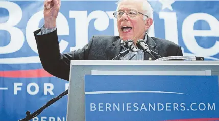  ?? STAFF.FILE.PHOTO.BY.NANCY.LANE ?? SURGING SANDERS: Democratic presidenti­al candidate Bernie Sanders speaks at a town meeting in Rochester, N.H., on June 28.