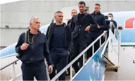  ?? Photograph: Fabio Rossi/AS Roma/Getty Images ?? José Mourinho and his squad stand on the walkway to their plane in Rome on Wednesday as they prepare to fly to England.