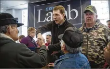  ?? GETTY IMAGES ?? LEFT: Conor Lamb, the Democratic congressio­nal candidate in Pennsylvan­ia’s 18th District, greets supporters after speaking to the United Mine Workers of America on Sunday.