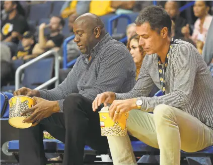  ?? JAYNE KAMIN-ONCEA/USA TODAY SPORTS ?? Lakers GM Rob Pelinka, right, said of team president Magic Johnson: “He loves to cast the vision and then my background is more to be the implemente­r.”