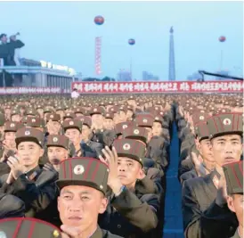  ??  ?? North Korean soldiers gather in July to celebrate the test launch of an interconti­nental ballistic missile.
| JON CHOL JIN/ AP FILE