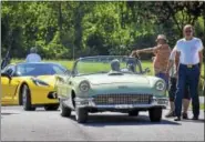  ??  ?? Ron Whitmoyer pauses at registrati­on to sign in his immaculate 1957 Ford Thunderbir­d.